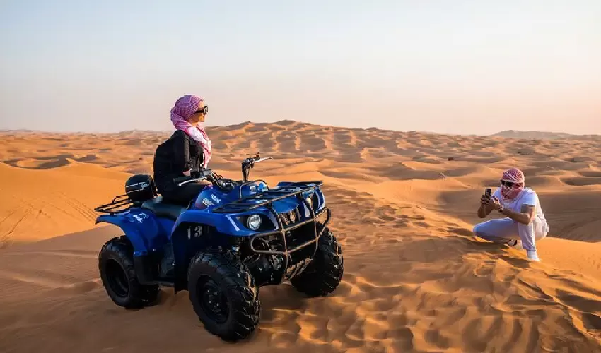 Quad Bike Tour Dubai with Tourists Riding in the Desert