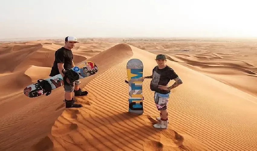 Desert Excursion Abu Dhabi: sandboarding on golden dunes